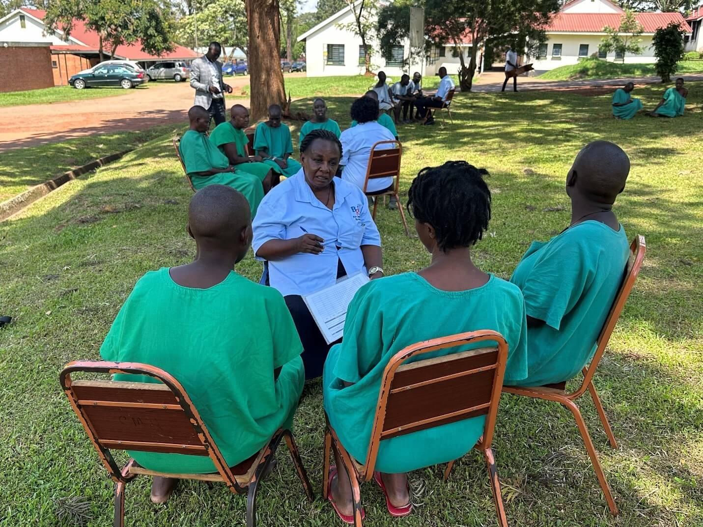 Figure 2: the Peer Support Worker with a group of patients